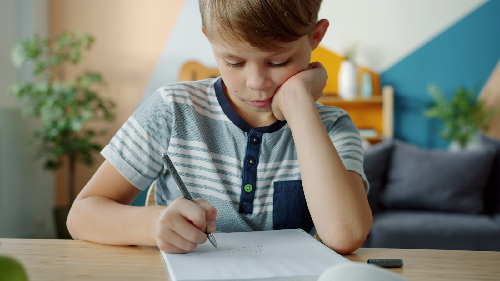 Young boy doing homework at a desk